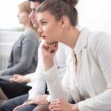 Patients sitting in a hospital waiting room in the UAE showing signs of waiting anxiety