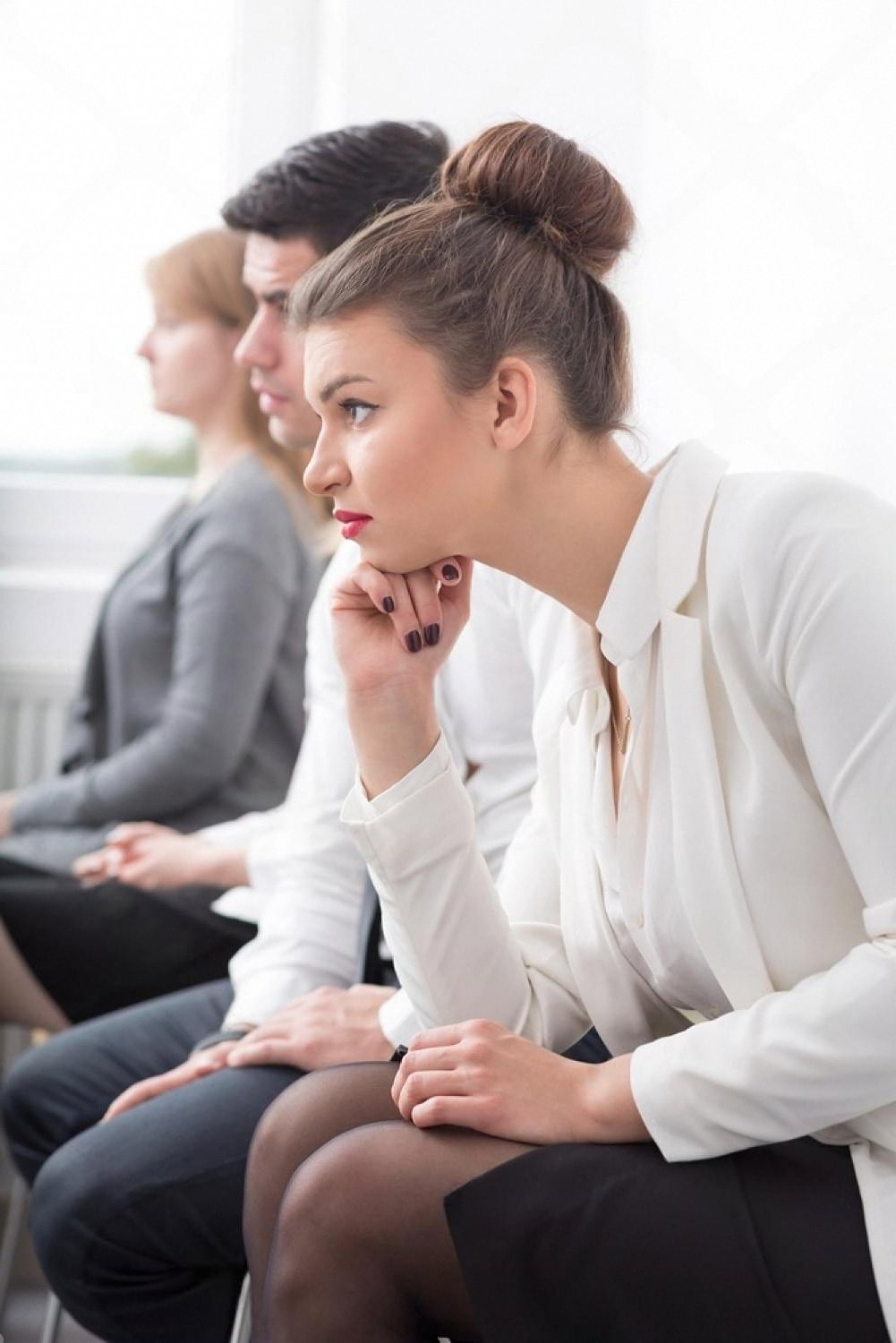 Patients sitting in a hospital waiting room in the UAE showing signs of waiting anxiety